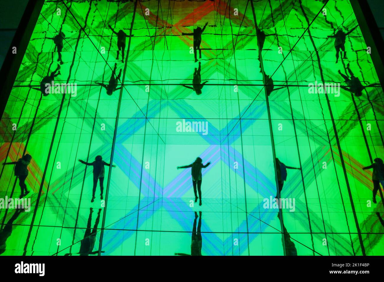 London UK 18 Sep. 2022 Members of staff pose with the installation INTO SIGHT, a large-scale installation by Sony Design, LED display systems are used alongside generative sound, see-through glass walls and mirrors combining Sony's Crystal LED display systems, which recently replaced green screen technology in one of the biggest developments in film production, with generative sound, see-through glass walls and mirrors.Paul Quezada-Neiman/Alamy Live News Stock Photo