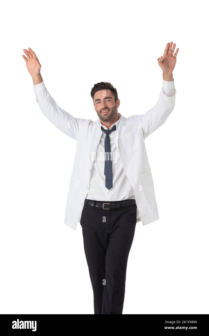 Young male medical doctor with stethoscope with raised arms isolated on white background full length studio portrait Stock Photo