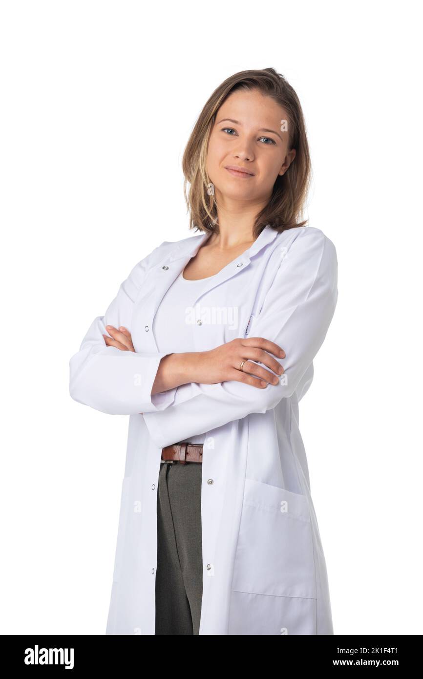 Portrait of happy young doctor woman standing with arms crossed isolated on white background Stock Photo
