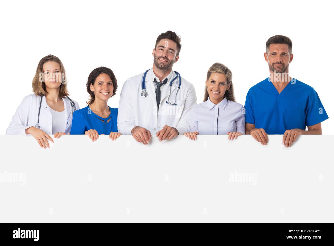 Portrait of confident medical team holding blank billboard isolated on white background, copy space for text Stock Photo