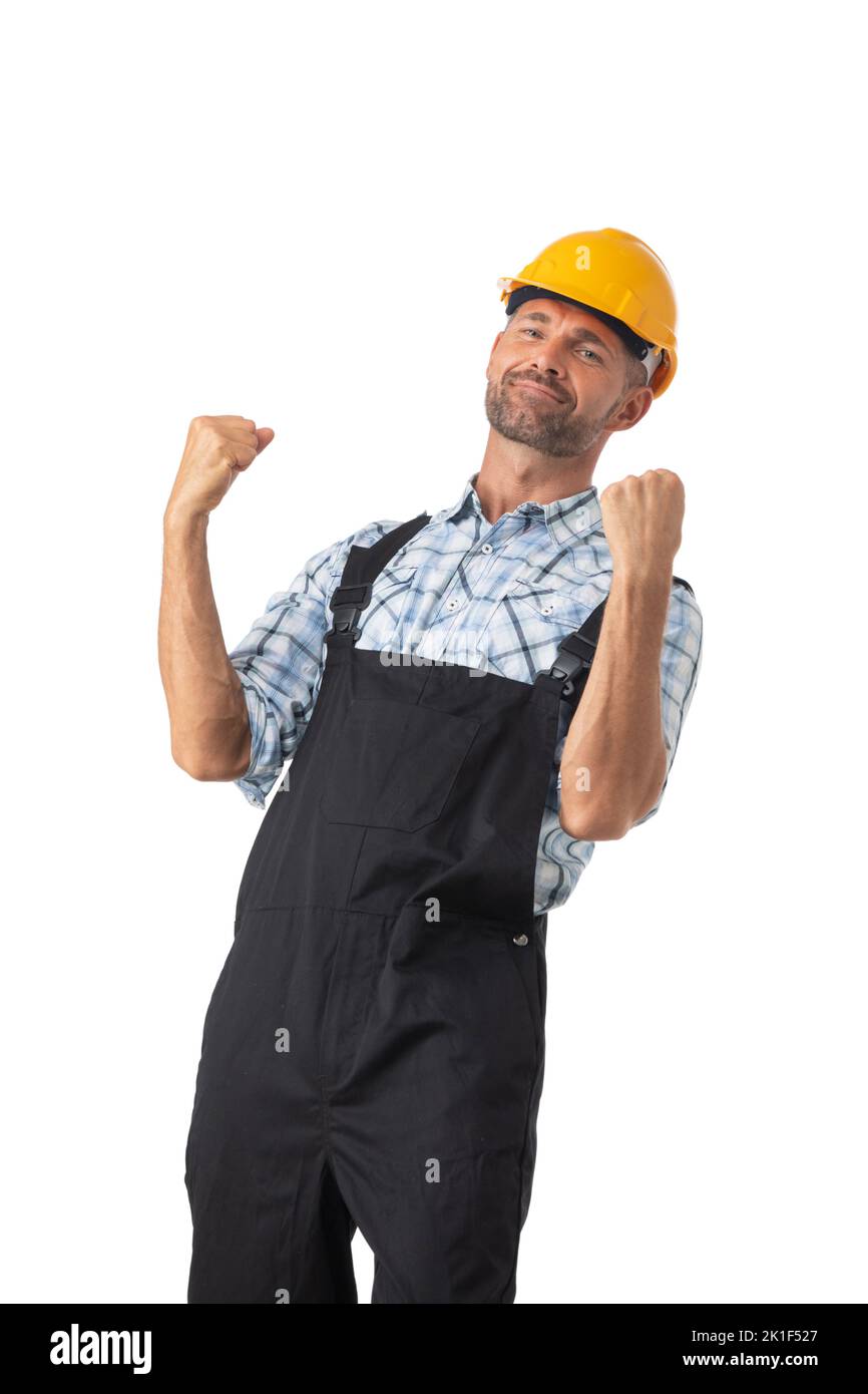 Portrait of happy confident male repairman contractor worker in coveralls and yellow hardhat isolated on white background Stock Photo