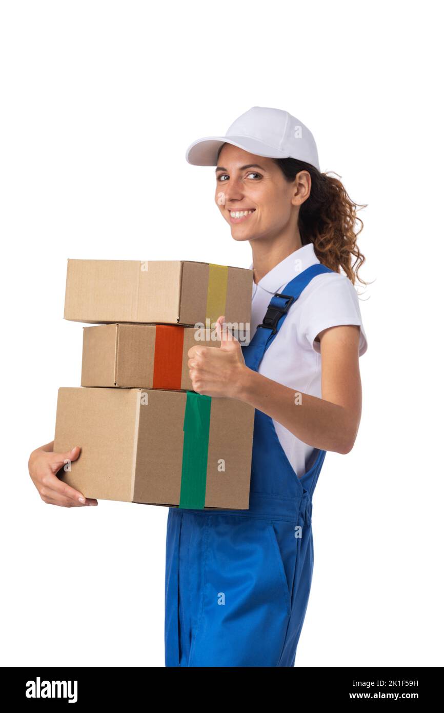 Portrait of happy smiling delivery woman with stack of boxes showing thumb up isolated on white background Stock Photo