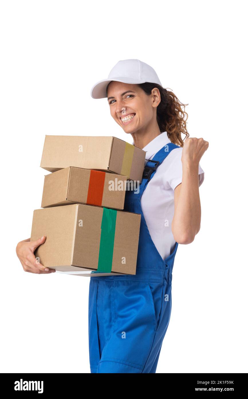 Portrait of delivery woman in white cap, t-shirt giving order boxes isolated on white background. Female courier step, cardboard box. Receiving packag Stock Photo