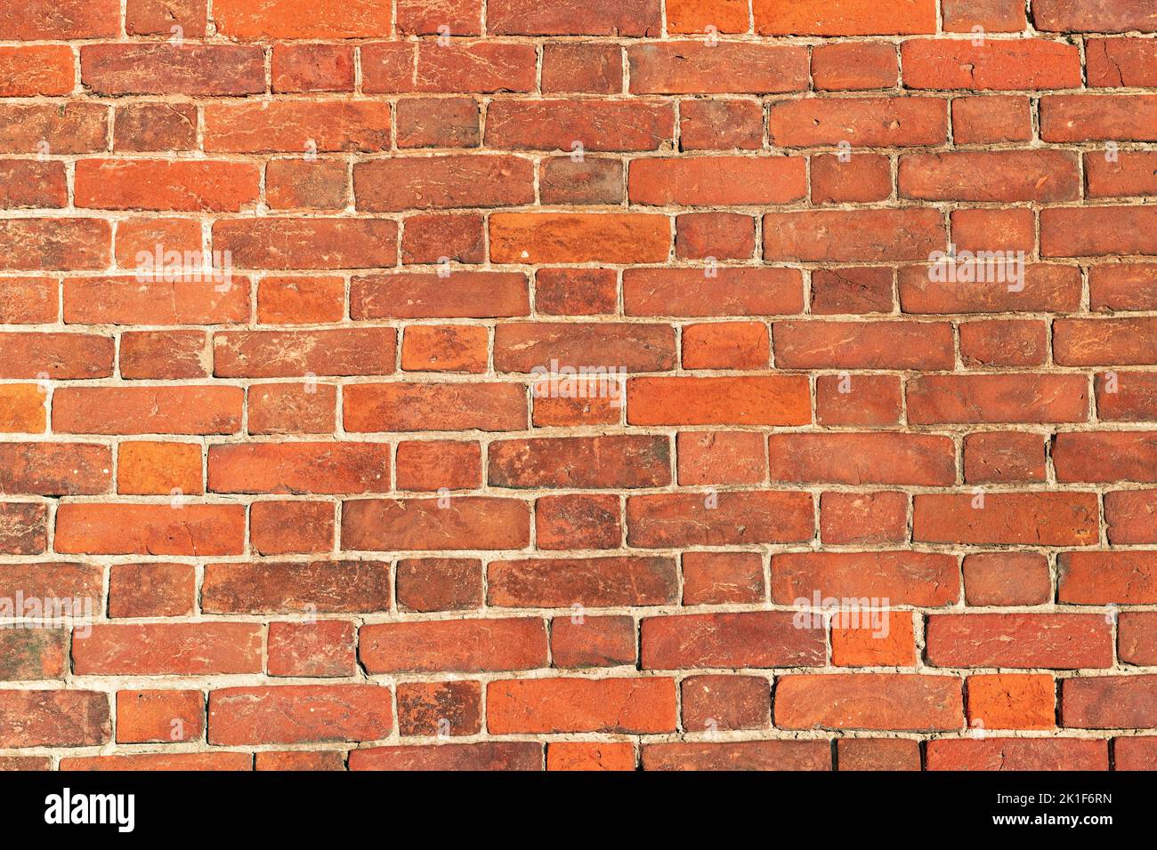 Section of red brick wall on a sunny day Stock Photo