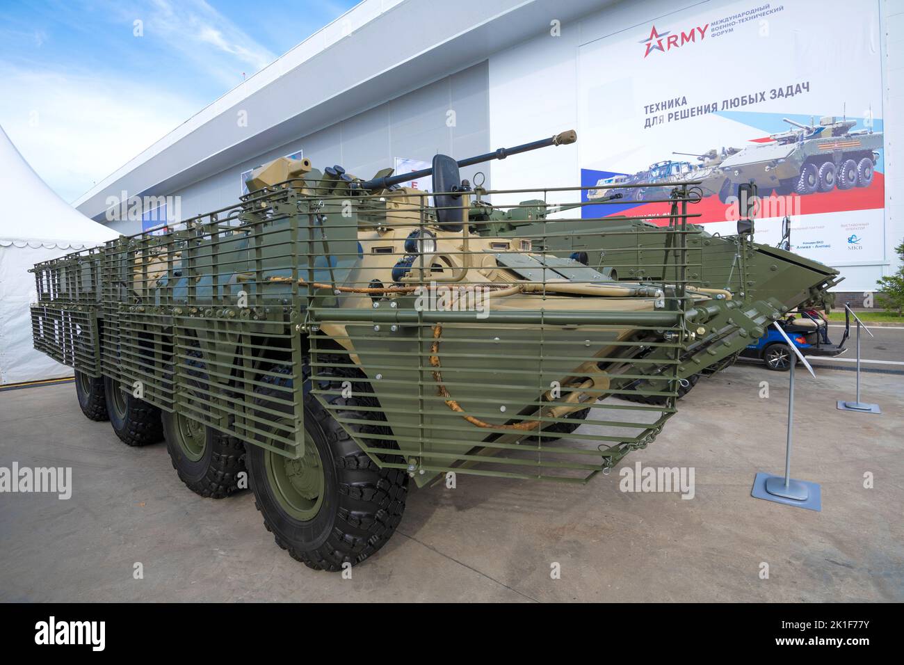 MOSCOW REGION, RUSSIA - AUGUST 19, 2022: BTR-82AT armored personnel carrier with a complex of protective lattice screens. Exhibit of the international Stock Photo