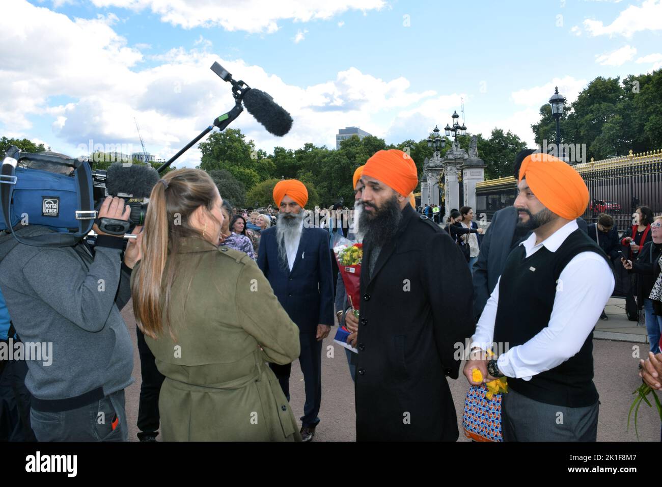 Sikhs being interviewed in front of Buckingham Palace during period of mourning for Queen Elizabeth II, London Sep 2022 Stock Photo