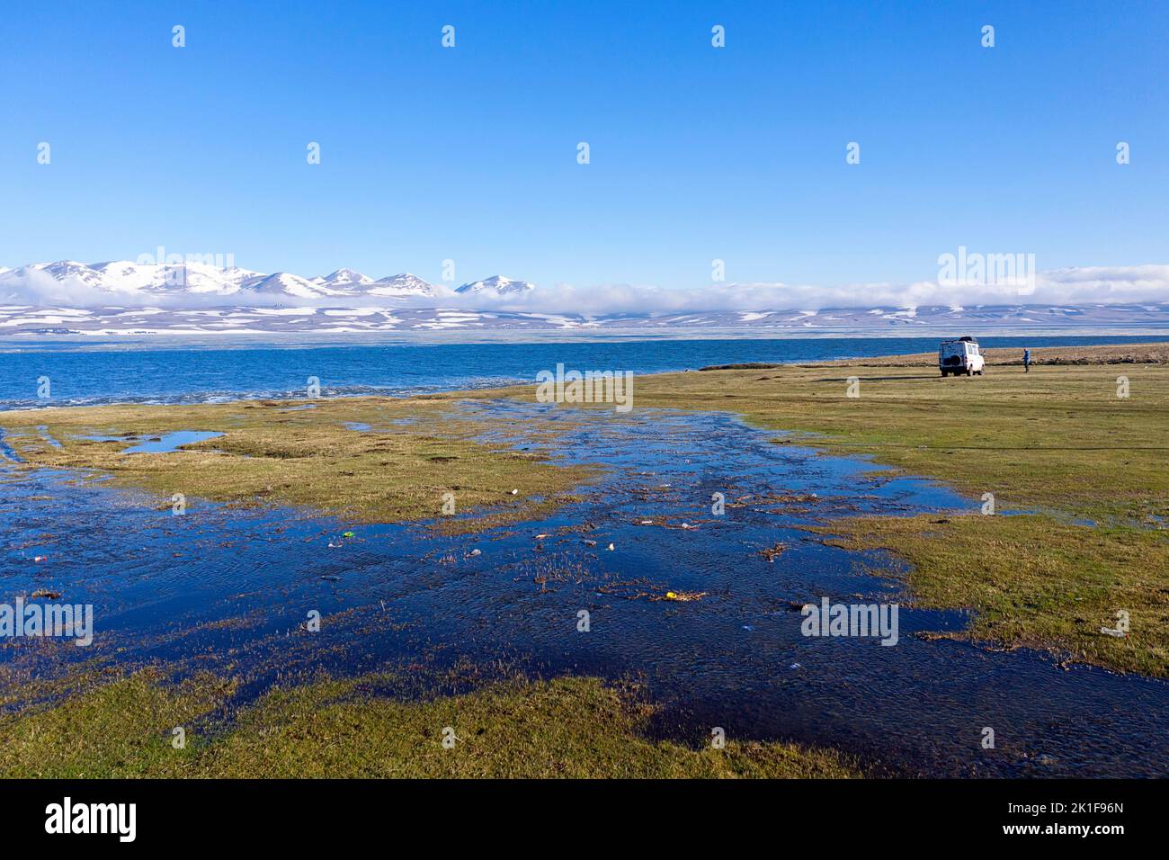 Tourist campervan parked on a shore of a spectacular Paravani Lake in ...