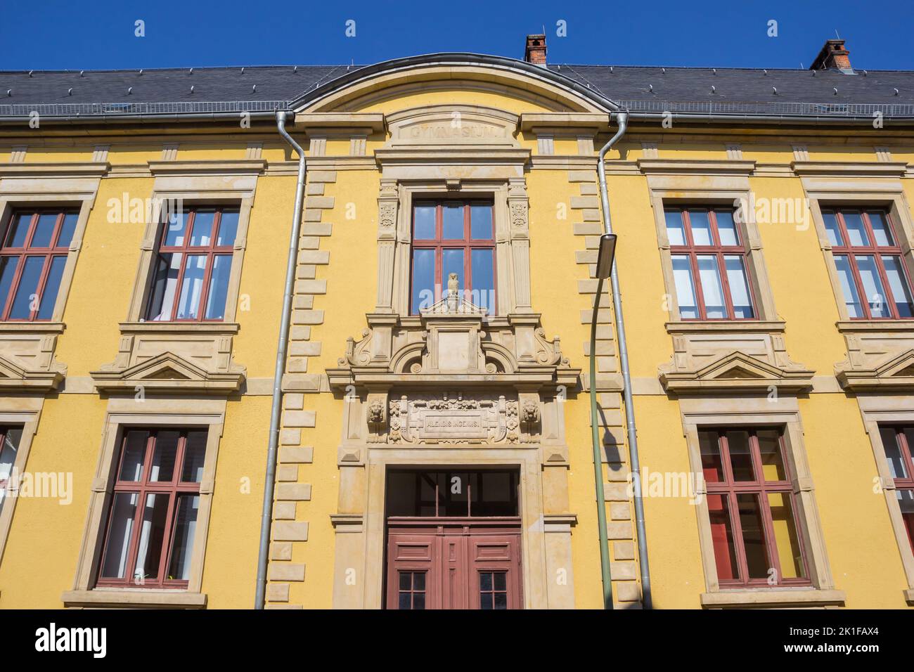 Yellow facade of a historic building in Helmstedt, Germany Stock Photo