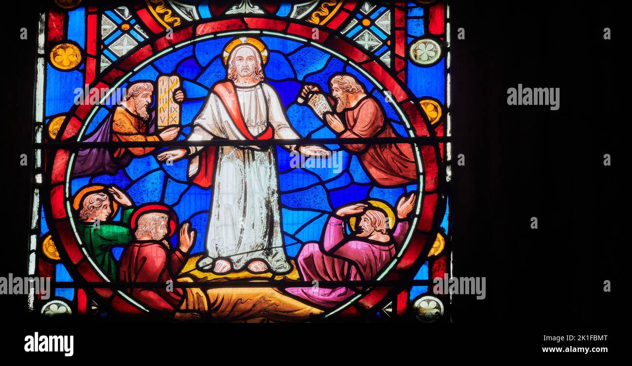 The transfiguration of Jesus Christ in front of his disciples; a stained glass window at Lincoln cathedral, England. Stock Photo