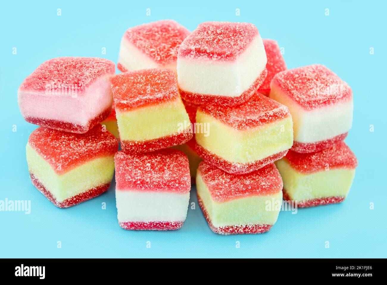Colorful sweets and blue background closeup Stock Photo