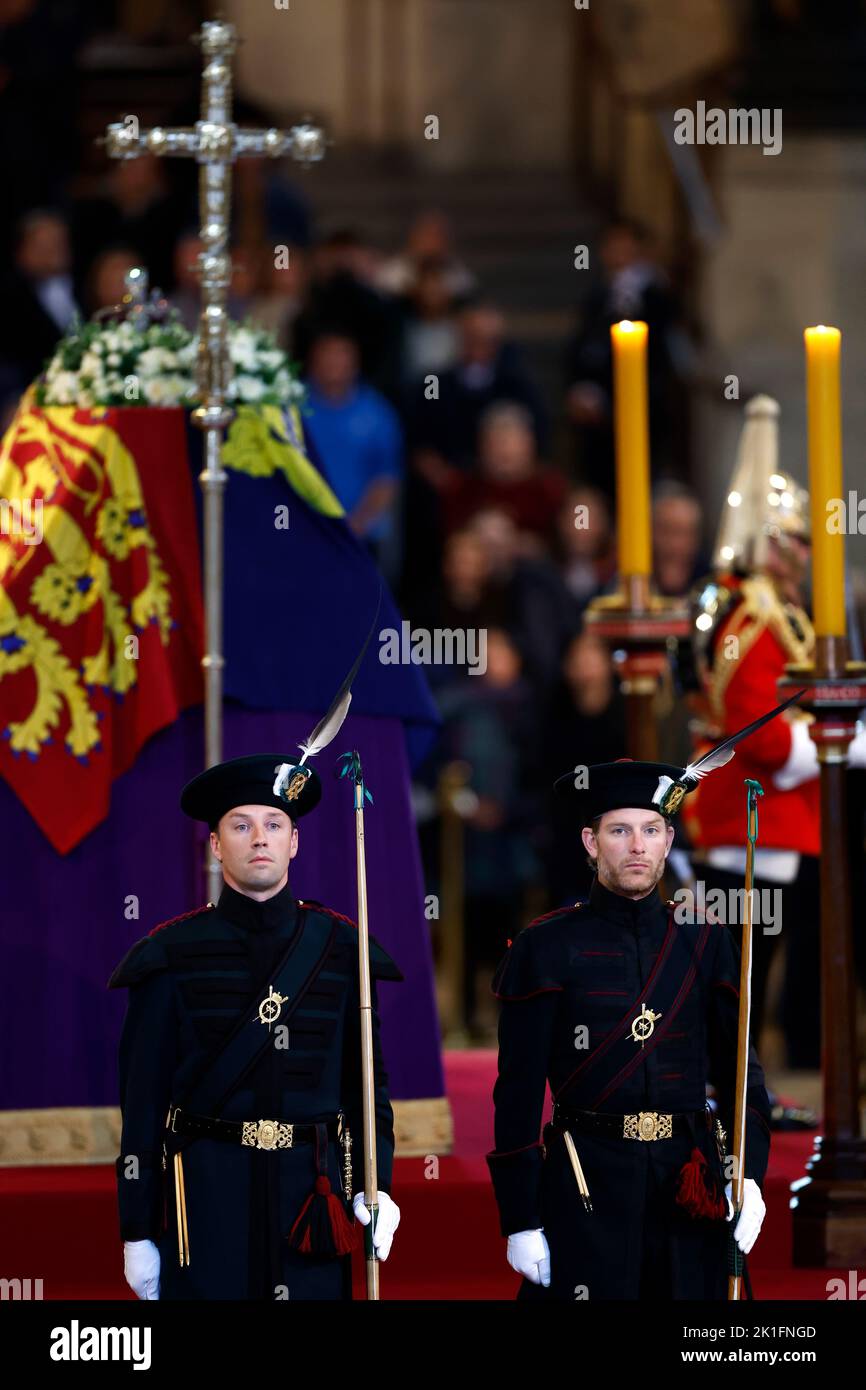 King's Bodyguard from the Royal Company of Archers stand guard where Queen Elizabeth II's flag-draped coffin is lying in state on the catafalque at Westminster Hall, London, ahead of her funeral on Monday. Picture date: Sunday September 18, 2022. Stock Photo