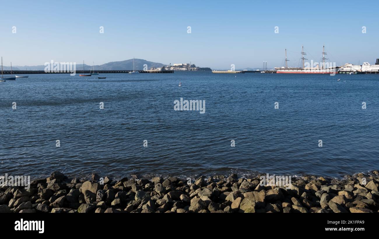 Seascape of the city of San Francisco, California, from Fort Mason, a former US Army fort located in the Marina District. In the background, Alcatraz Stock Photo