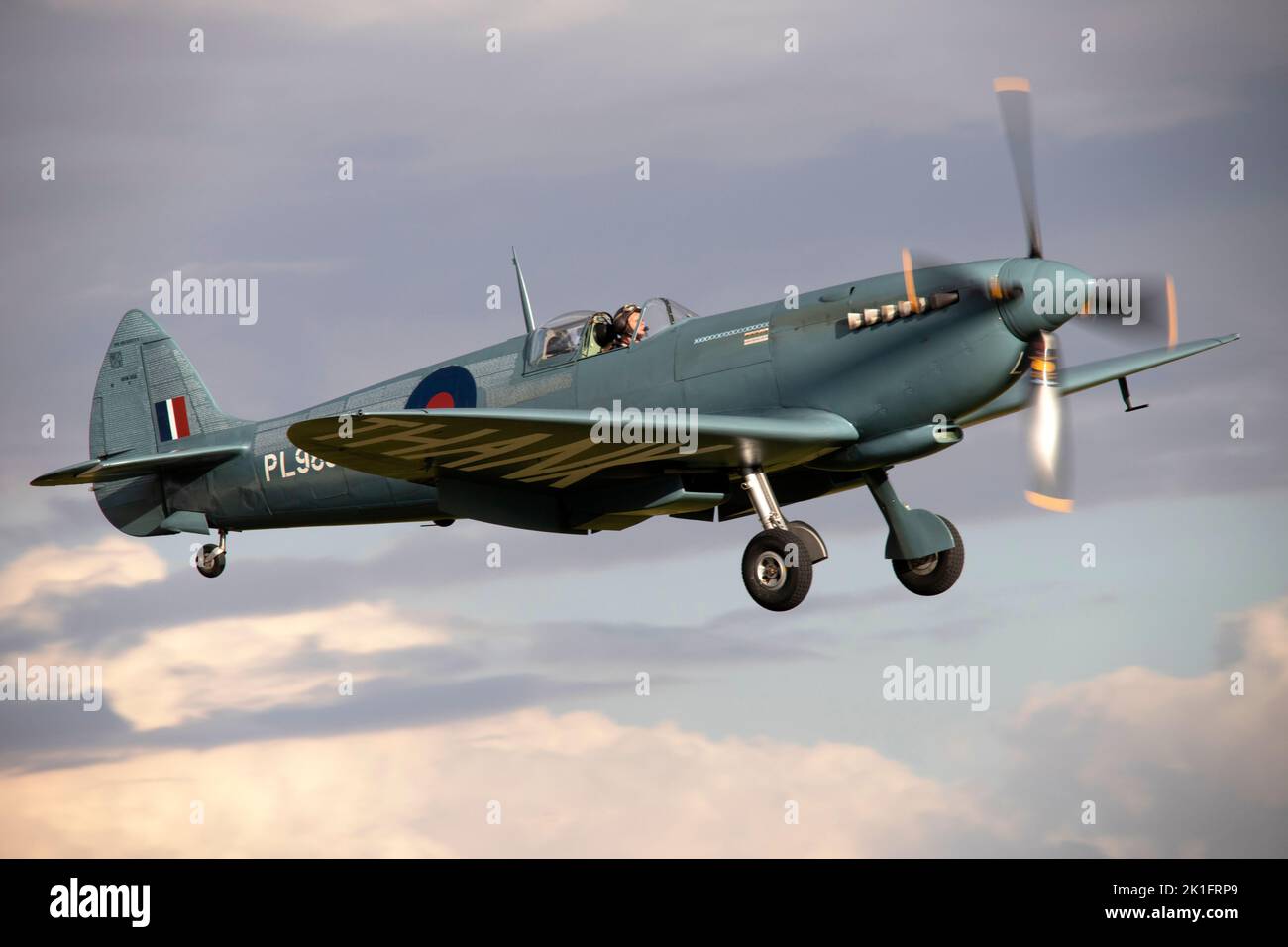 Supermarine Spitfire PR.XI (The NHS Spitfire) PL983 (G-PRXI) landing at dusk, after it's flying display at the IWM Duxford Battle of Britain Air show Stock Photo