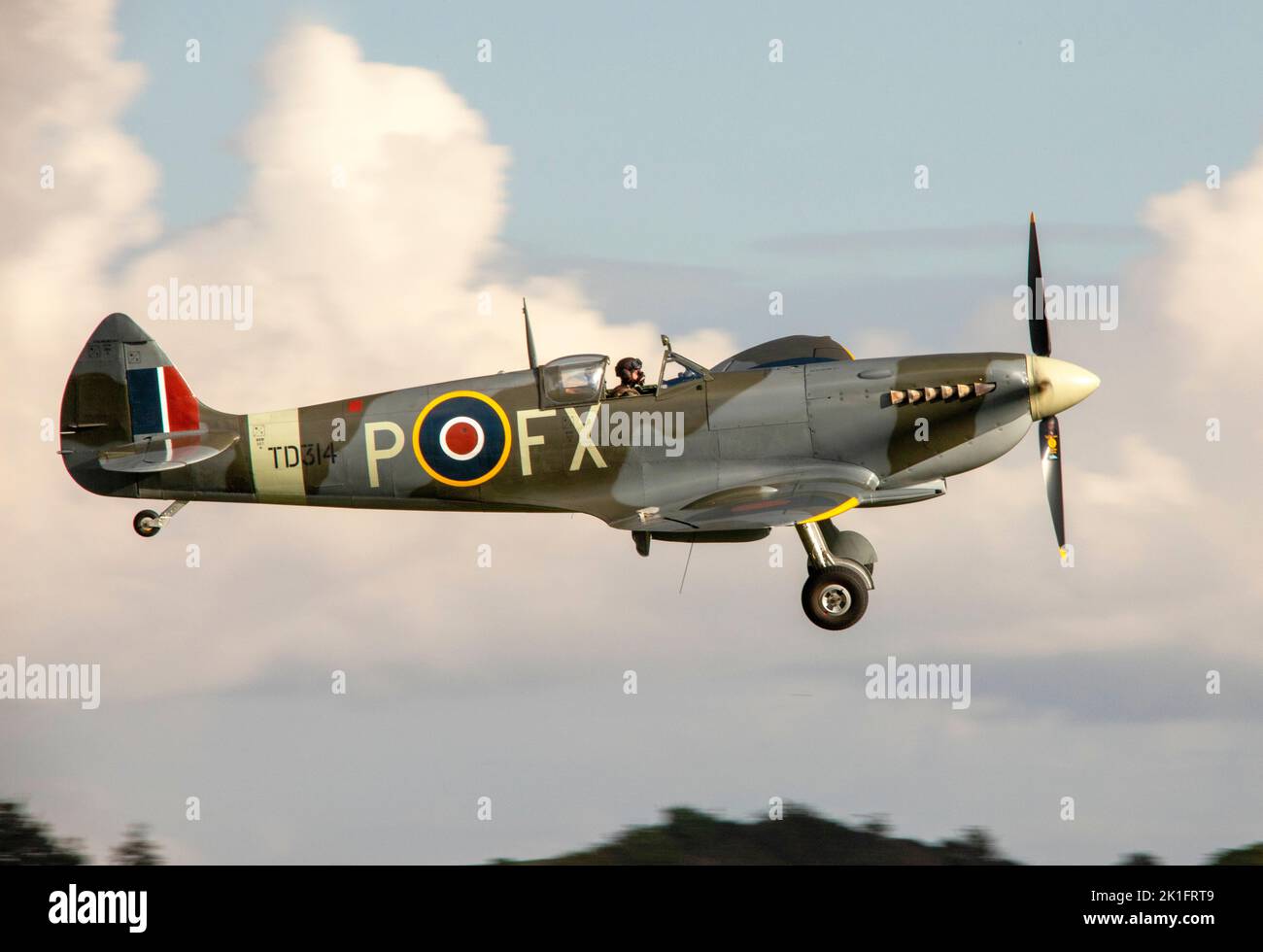Supermarine Spitfire Mk.VIII, td314 landing at dusk, after it's flying display at the IWM Duxford Battle of Britain Air show 10th September 2022 Stock Photo