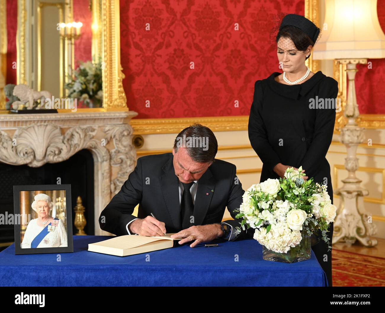 Brazilian President Jair Bolsonaro and First Lady Michelle de Paula Bolsonaro sign a book of condolence at Lancaster House in London, following the death of Queen Elizabeth II. Picture date: Sunday September 18, 2022. Stock Photo