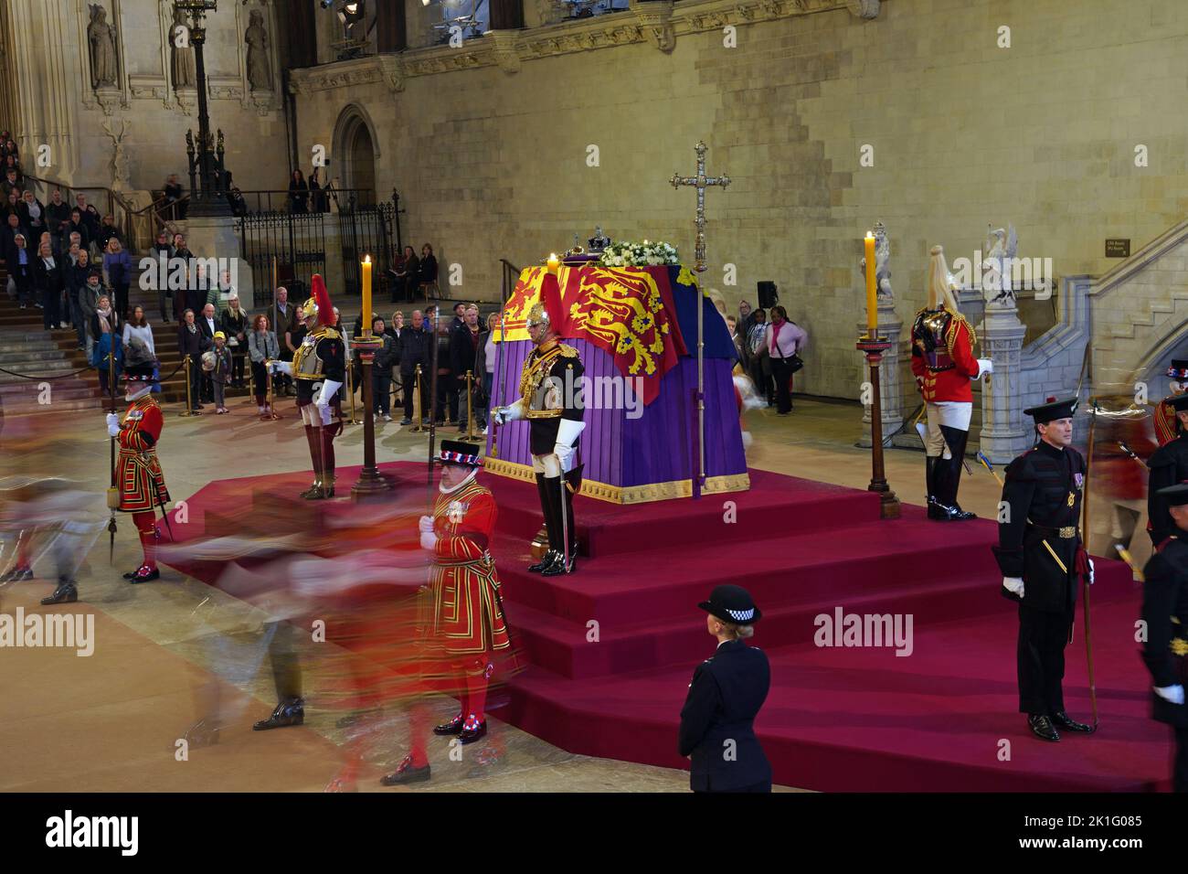 Members of the public view the coffin of Queen Elizabeth II, lying in state on the catafalque in Westminster Hall, at the Palace of Westminster, London, ahead of her funeral on Monday. Picture date: Sunday September 18, 2022. Stock Photo