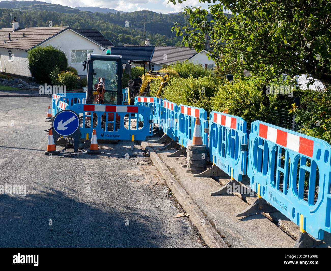 Construction work to install fibre optic broadband to a street in Ambleside, Lake District, UK. Stock Photo