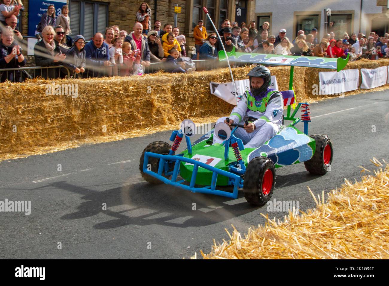 Longridge, Preston. UK News 18 September 2022; Soapbox Derby community charity event happening in the heart of the village A day of “family fun, racing, wacky costumes and carts, thrills and spills” attracted thousands of visitors to the town's main street. Motorless, hand-made, wooden vehicles raced down Berry Lane as the village's main high street was converted into an unusual race track for the day. The event has been organised to raise vital funds for local charity Longridge Community Action. 'Fitness Plus Cart No.6 Credit ; MediaWorldImages/Alamy LiveNews Stock Photo