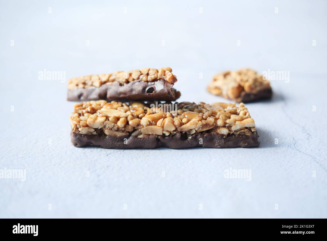 protein almond chocolate sweet bar on white Stock Photo