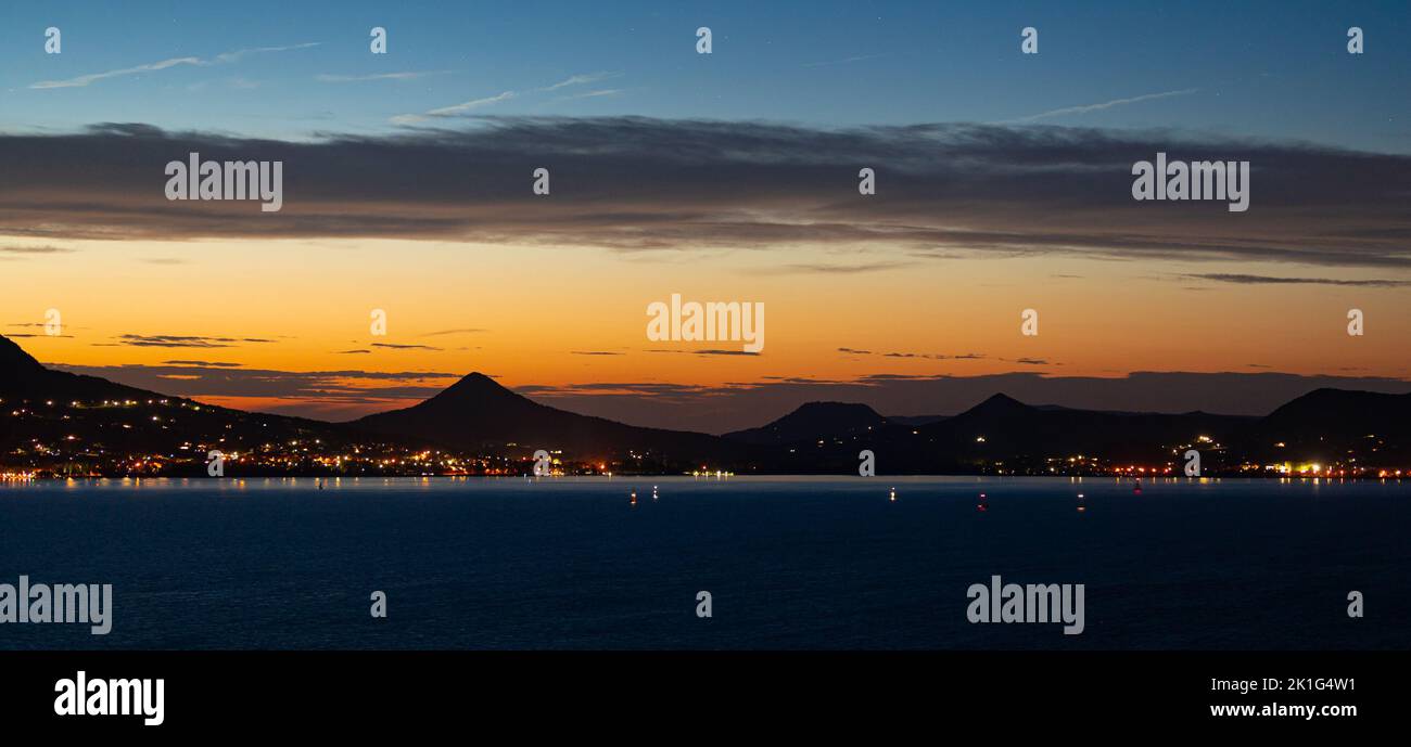 Scenic panoramic view of an ancient volcanic landscape at Lake Balaton in Hungary during the evening twilight Stock Photo