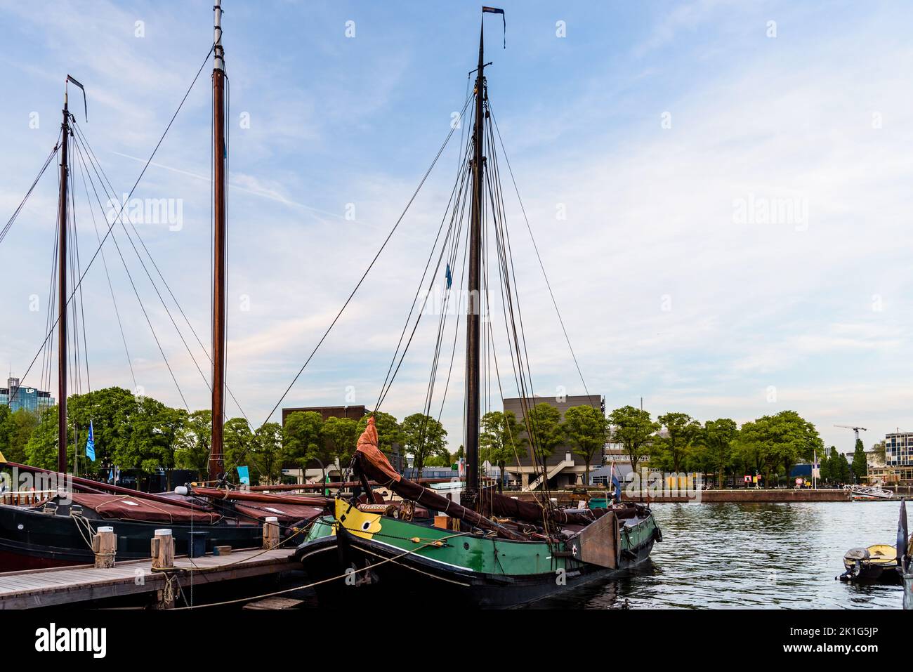 Amsterdam, Netherlands - May 6, 2022: Old wooden vessels moored in the Society Museum Harbor Amsterdam or Vereniging Museumhaven Amsterdam Stock Photo
