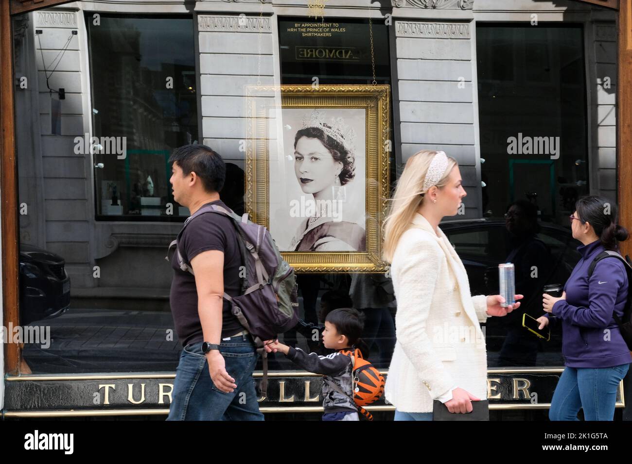Jermyn Street, London, UK. 18th Sept 2022. Mourning the death of Queen Elizabeth II aged 96. Shop windows near Piccadilly display pictures and dedications to Queen Elizabeth. Turnbull & Asser, Jermyn Street. Credit: Matthew Chattle/Alamy Live News Stock Photo