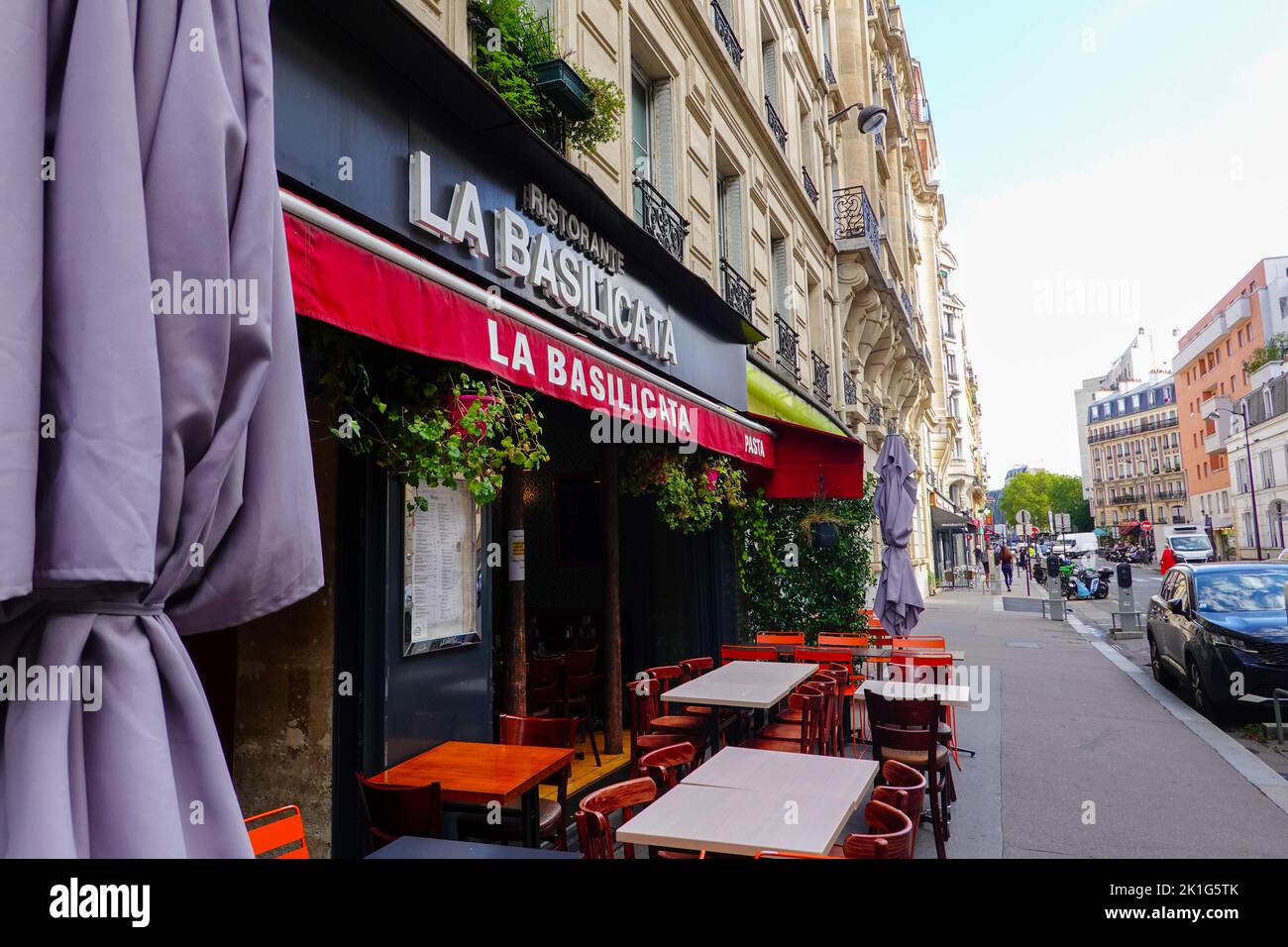 Empty tables, late morning, in front of the Italian Restaurant La Basilicata in the 14th Arrondissement, Paris, France. Stock Photo