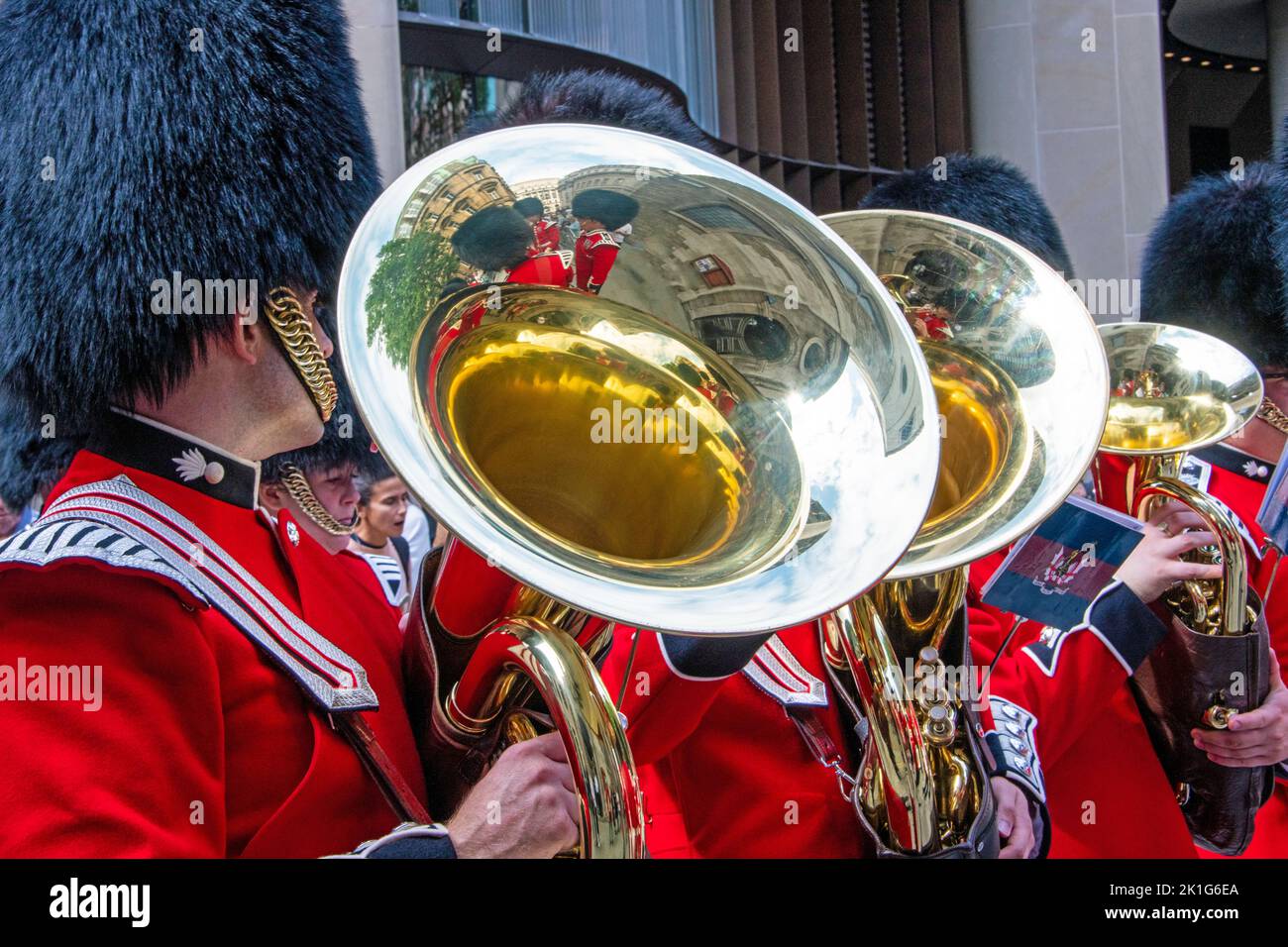 British king's guards in red uniform with trumpets, playing music Stock