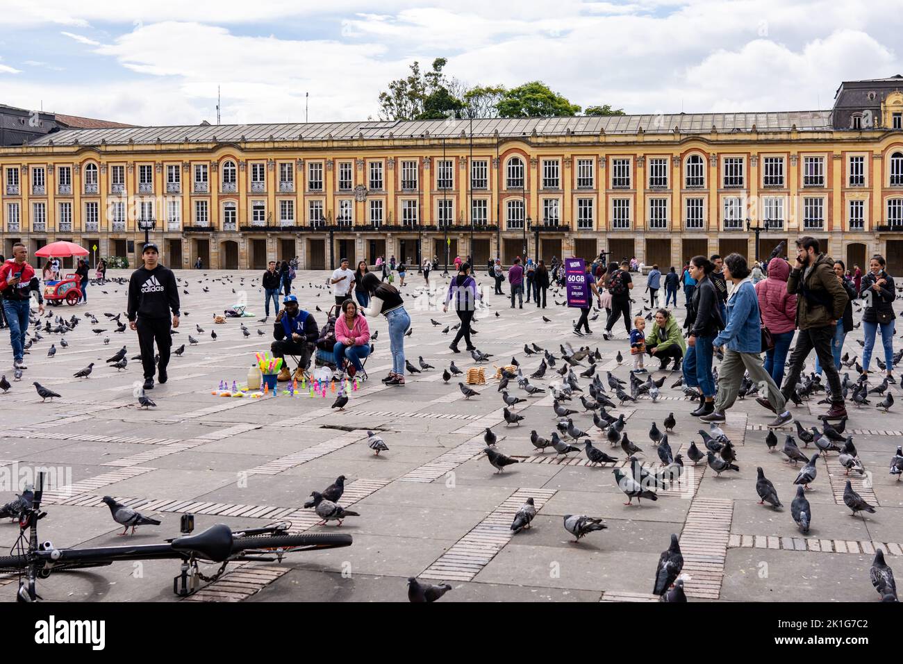 A Town Square in Bogota, Colombia attracts many pigeons Stock Photo