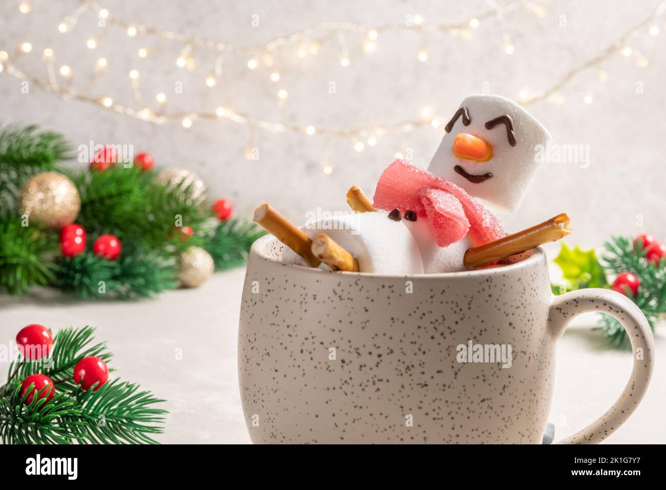 Mug with hot chocolate with melted marshmallow snowman Stock Photo