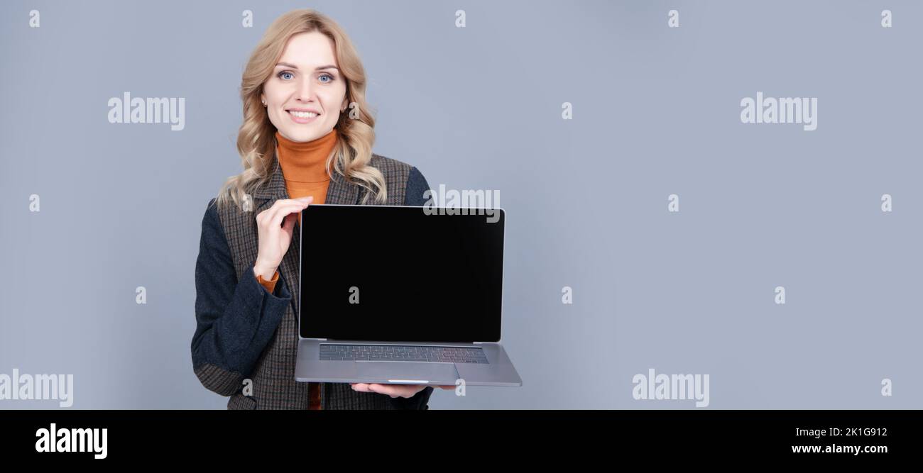 It is made for you. Computer user hold open laptop grey background. PC ...