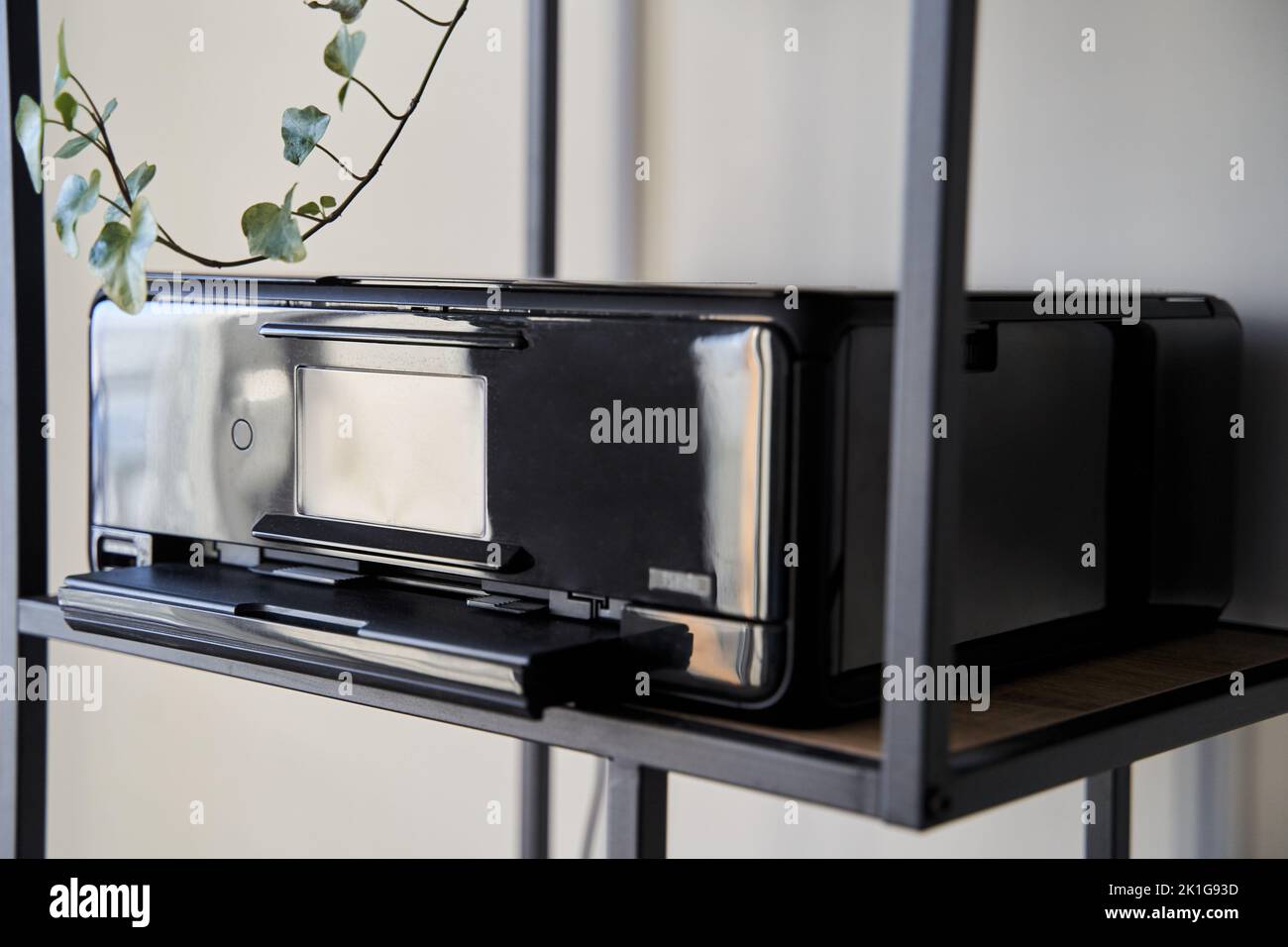 Black inkjet printer is on the shelf Stock Photo