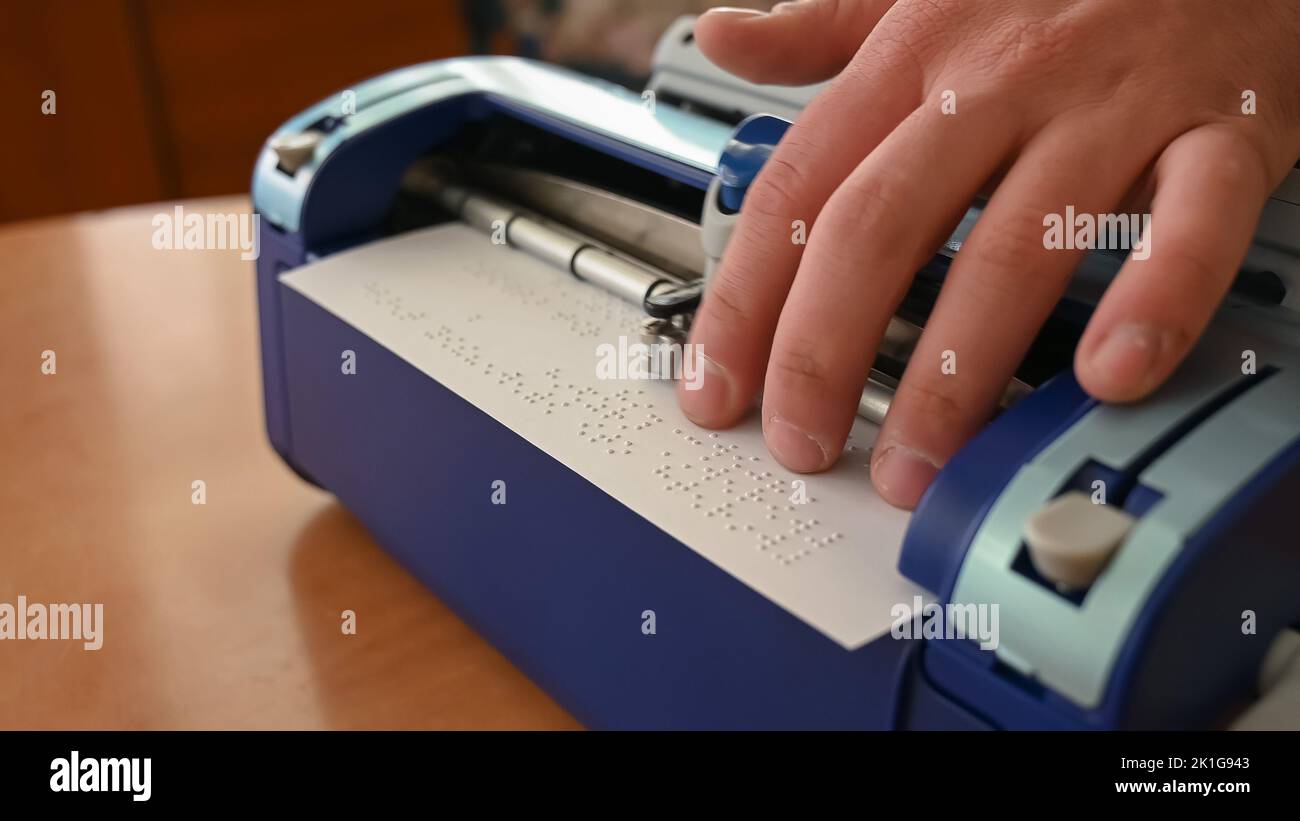 Blind man using braille typewriter Stock Photo Alamy