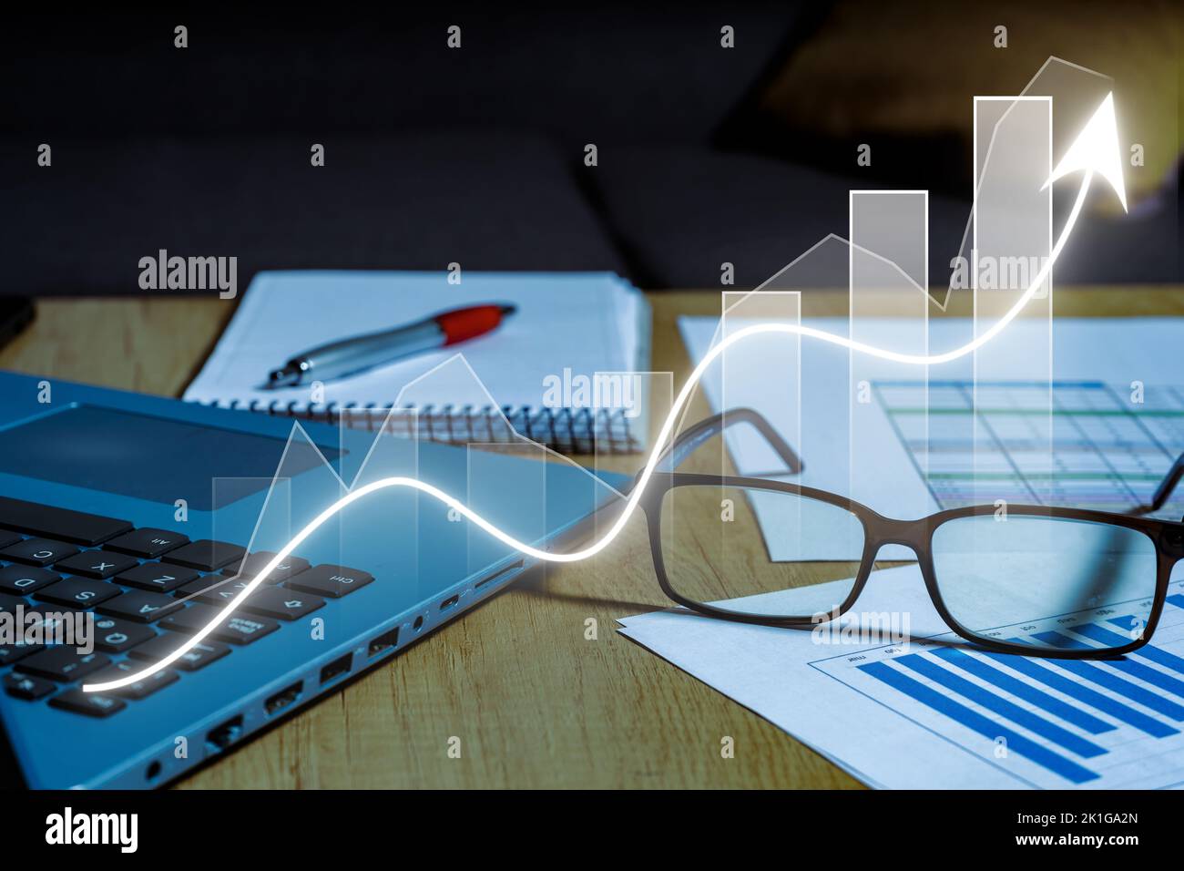 Work table at home with pen, papers, bills, charts, glasses, computer and calculator. Concept