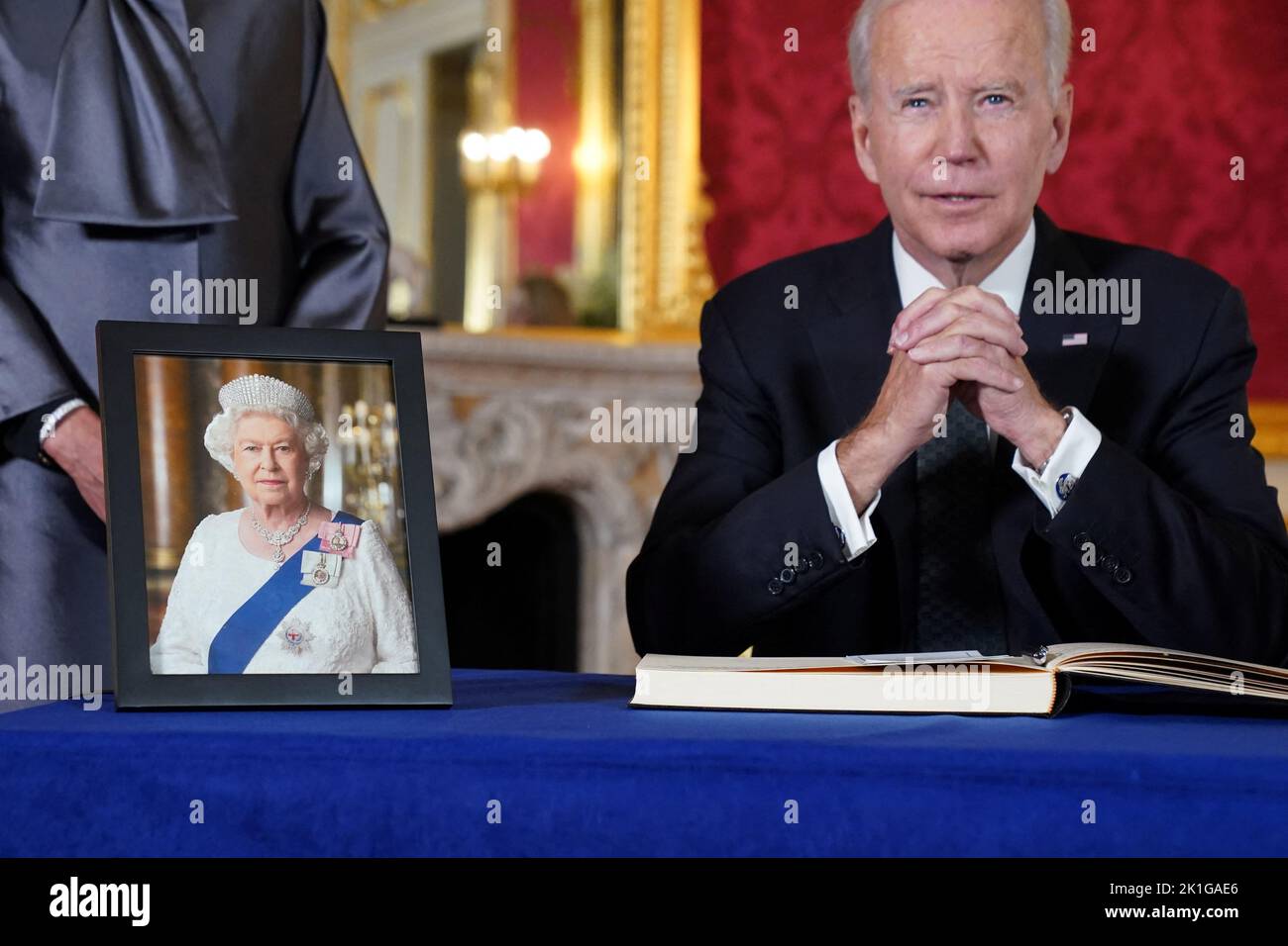 U.S. President Joe Biden prepares to sign a condolence book for Britain's Queen Elizabeth, following her death, at Lancaster House in London, Britain, September 18, 2022. REUTERS/Kevin Lamarque Stock Photo