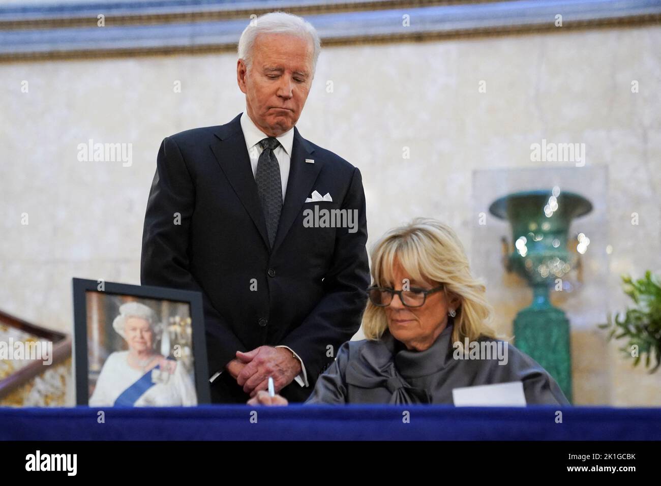 U.S. first lady Jill Biden, next to U.S. President Joe Biden, signs a condolence book for Britain's Queen Elizabeth, following her death, at Lancaster House in London, Britain, September 18, 2022. REUTERS/Kevin Lamarque Stock Photo