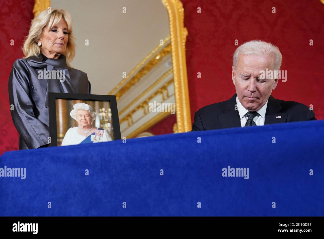 U.S. President Joe Biden, accompanied by first lady Jill Biden, signs a condolence book for Britain's Queen Elizabeth, following her death, at Lancaster House in London, Britain, September 18, 2022. REUTERS/Kevin Lamarque Stock Photo