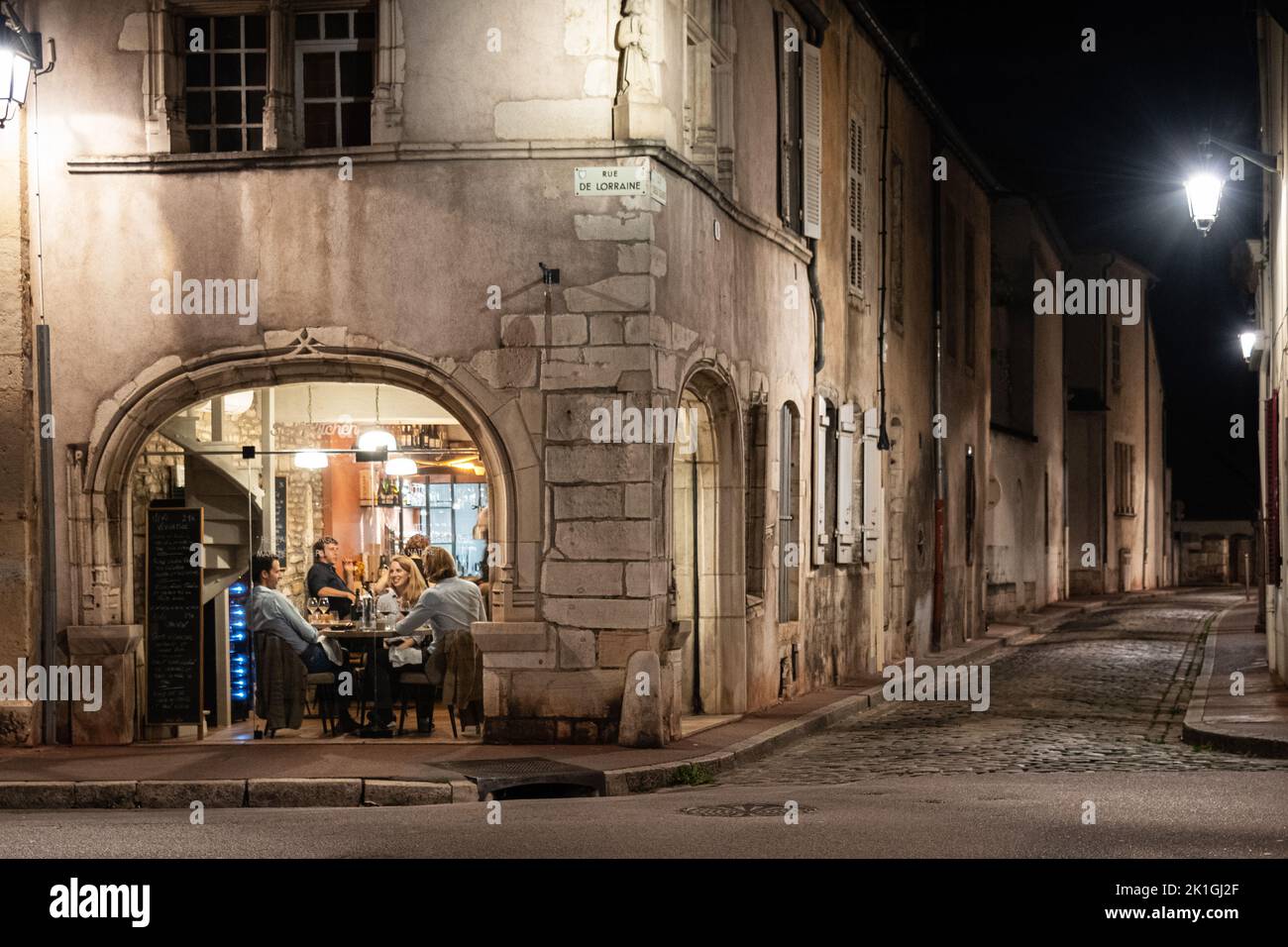Diners relaxing in the Soul Kitchen Restaurant at night, Beaune, Burgundy, France Stock Photo