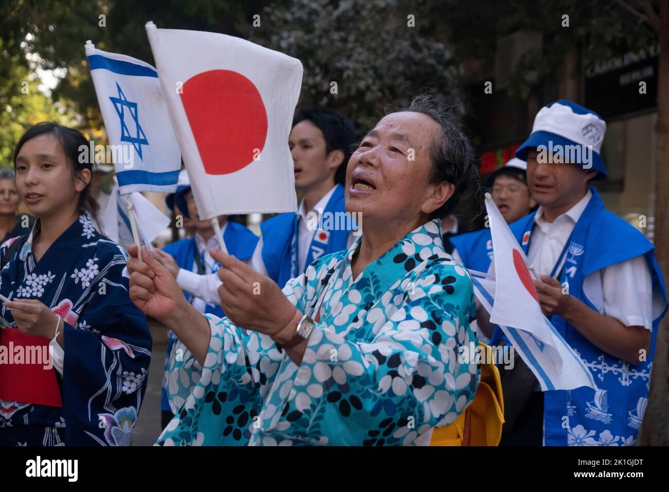 Members of the Japanese Makuya movement wave the national flags of Israel and Japan and sing iconic Jewish songs in Zion Square on September 18, 2022 in downtown Jerusalem, Israel. The Makuya movement is a religious movement which was founded in 1948 in Japan, Its members are passionate supporters of Israel and consider the establishment of the Jewish state and the unification of Jerusalem 19 years later to be the fulfillment of biblical prophecies. Stock Photo