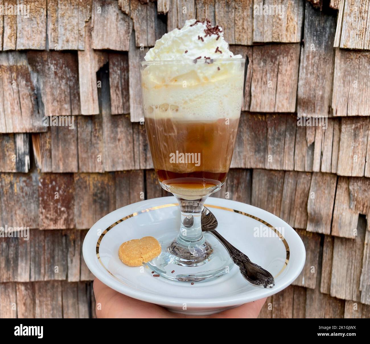 Traditional Swiss Huuskafi, coffee with sugar, schnapps and whipped