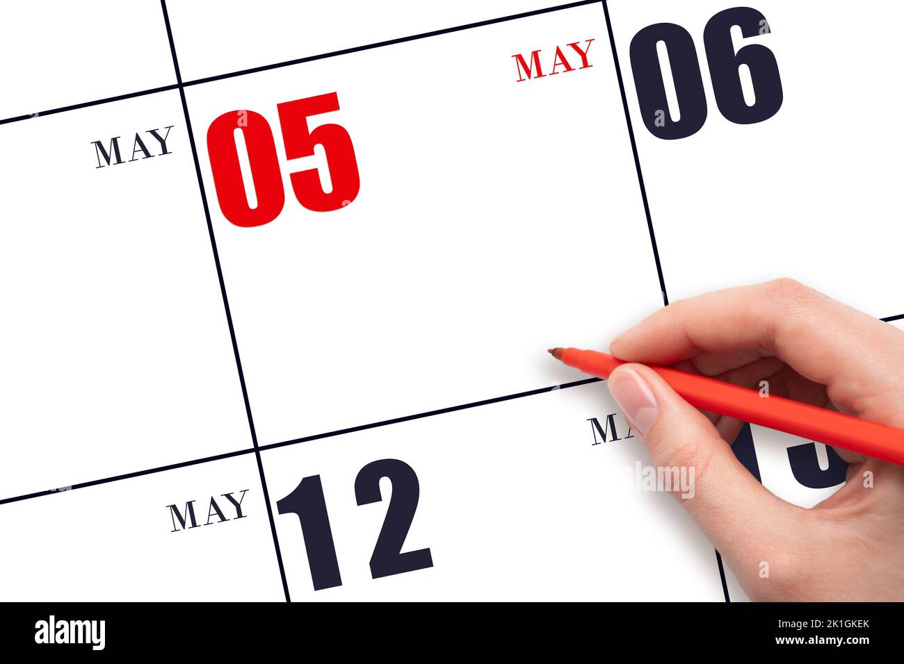 May 12nd. Day 12 Of Month, Calendar Date. The Hand Holds A Black Pen And  Writes The Calendar Date. Spring Month, Day Of The Year Concept Stock  Photo, Picture and Royalty Free