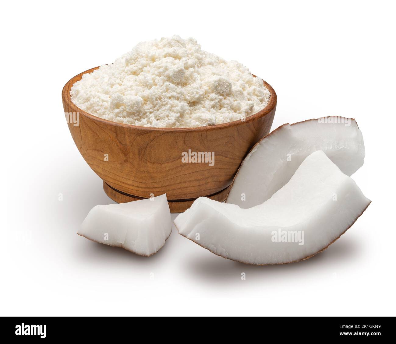 Wooden bowl full of coconut flour isolated on white Stock Photo