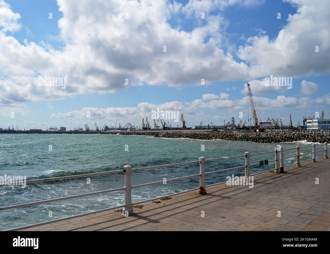 CONSTANTA, ROMANIA - SEPTEMBER 2022: The promenade at Constanta with the industrial infrastructure of the port behind. Stock Photo