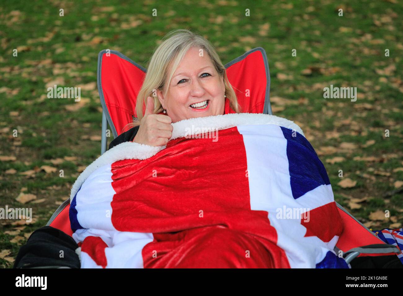 London, UK. 18th Sep, 2022. Members of the public queue and wait along the route for tomorrow's funeral of Queen Elizabeth II on The Mall in Westminster. Many have brought blankets, union jack flags, sleeping bags, chairs, flasks and even tents Credit: Imageplotter/Alamy Live News Stock Photo