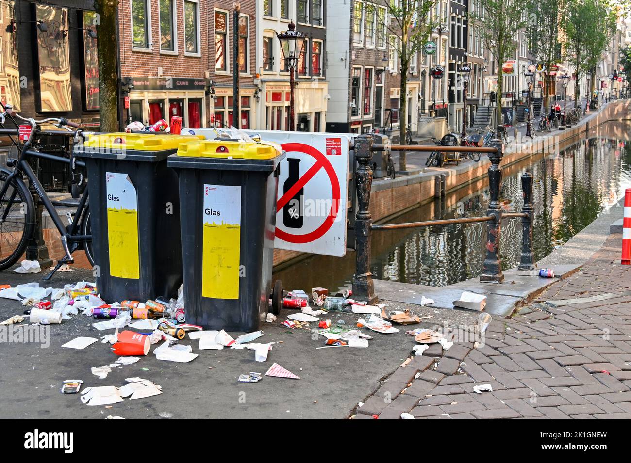 Amsterdam, Netherlands - August 2022: Rubbish and litter dumped alongside waste bins on a street in the centre of Amsterdam Stock Photo