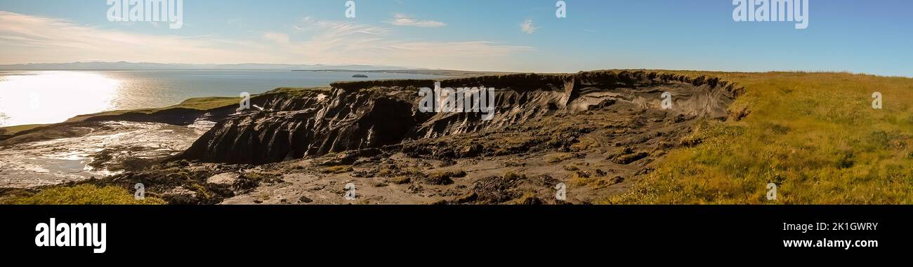 Slump in cliff caused by melting permafrost on Herschel Island, Yukon Territory, Canada along Mackenzie Bay., Stock Photo