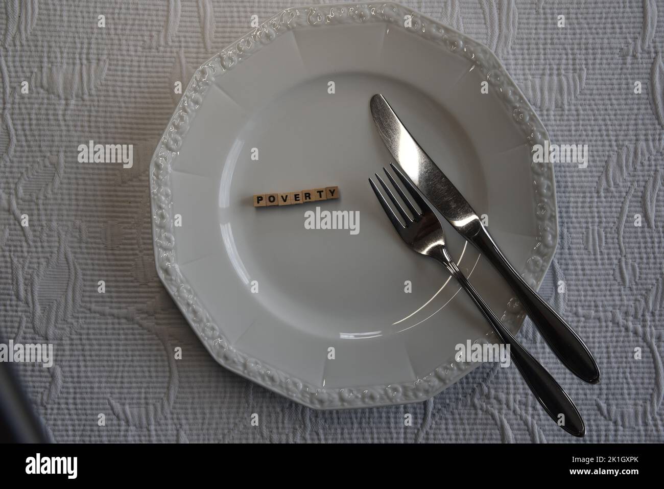 the german word for poverty with wodden bricks on a plate Stock Photo
