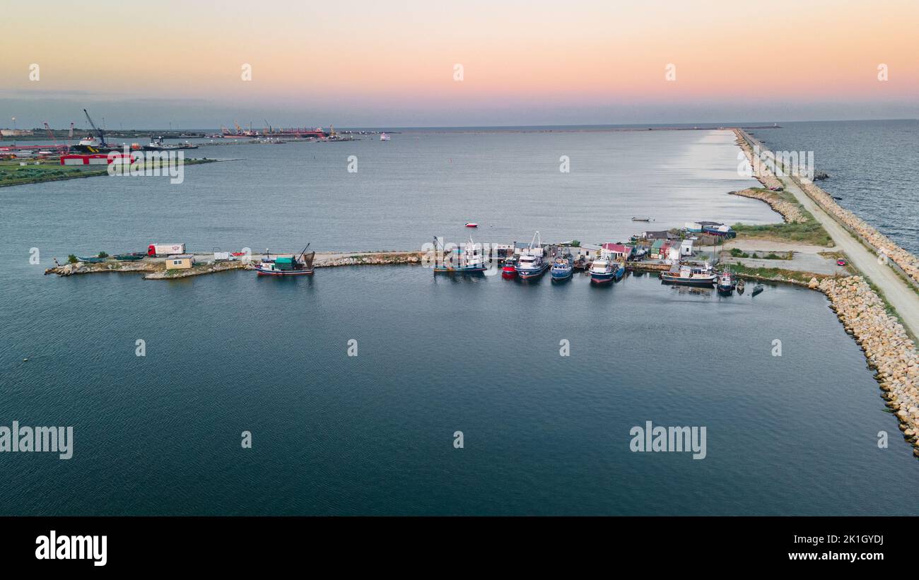 Aerial view of a harbor with boats sailing and docked. Photography was ...