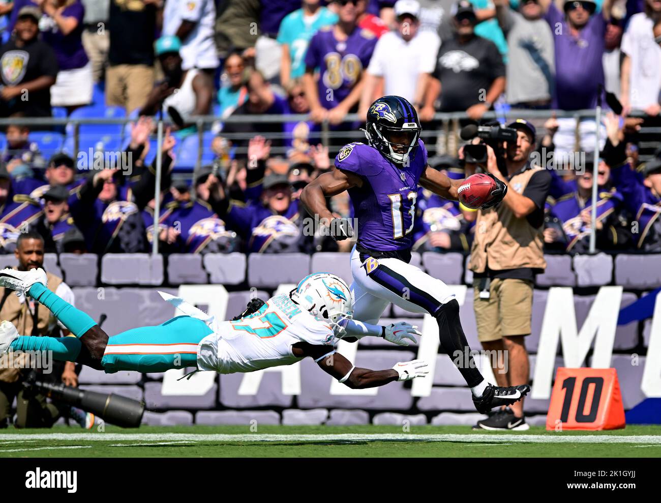 Baltimore, USA. 18th Sep, 2022. Baltimore Ravens wide receiver Devin Duvernay (13) evades Miami Dolphins cornerback Keion Crossen (27) on a 103-yard kickoff return for a touchdown during the first half of an NFL game at M&T Bank Stadium in Baltimore, Maryland, on Sunday, September 18, 2022. Photo by David Tulis/UPI Credit: UPI/Alamy Live News Stock Photo