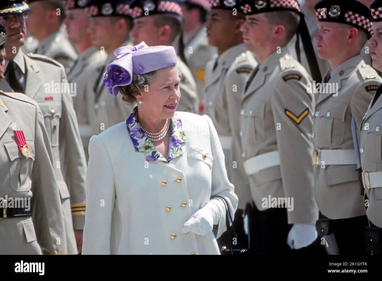 Queen Elizabeth visits Calgary Alberta, inspecting the Calgary Highlanders in June 27 1990 on her tour of Canada Stock Photo